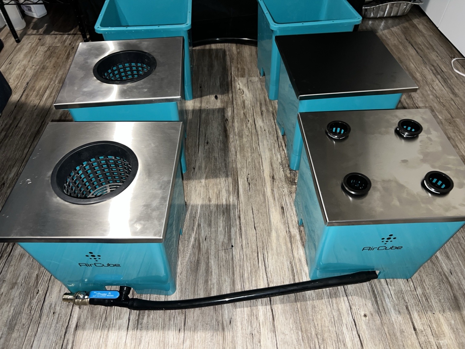 Collection of stainless lid configurations on AirCube-compatible buckets